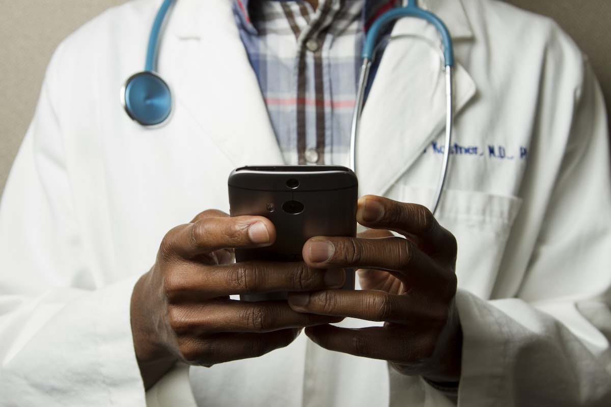 Doctor communicating with international patient using multilingual interpreter support